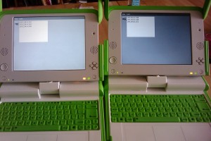 Two XO laptops demonstrating mesh networking